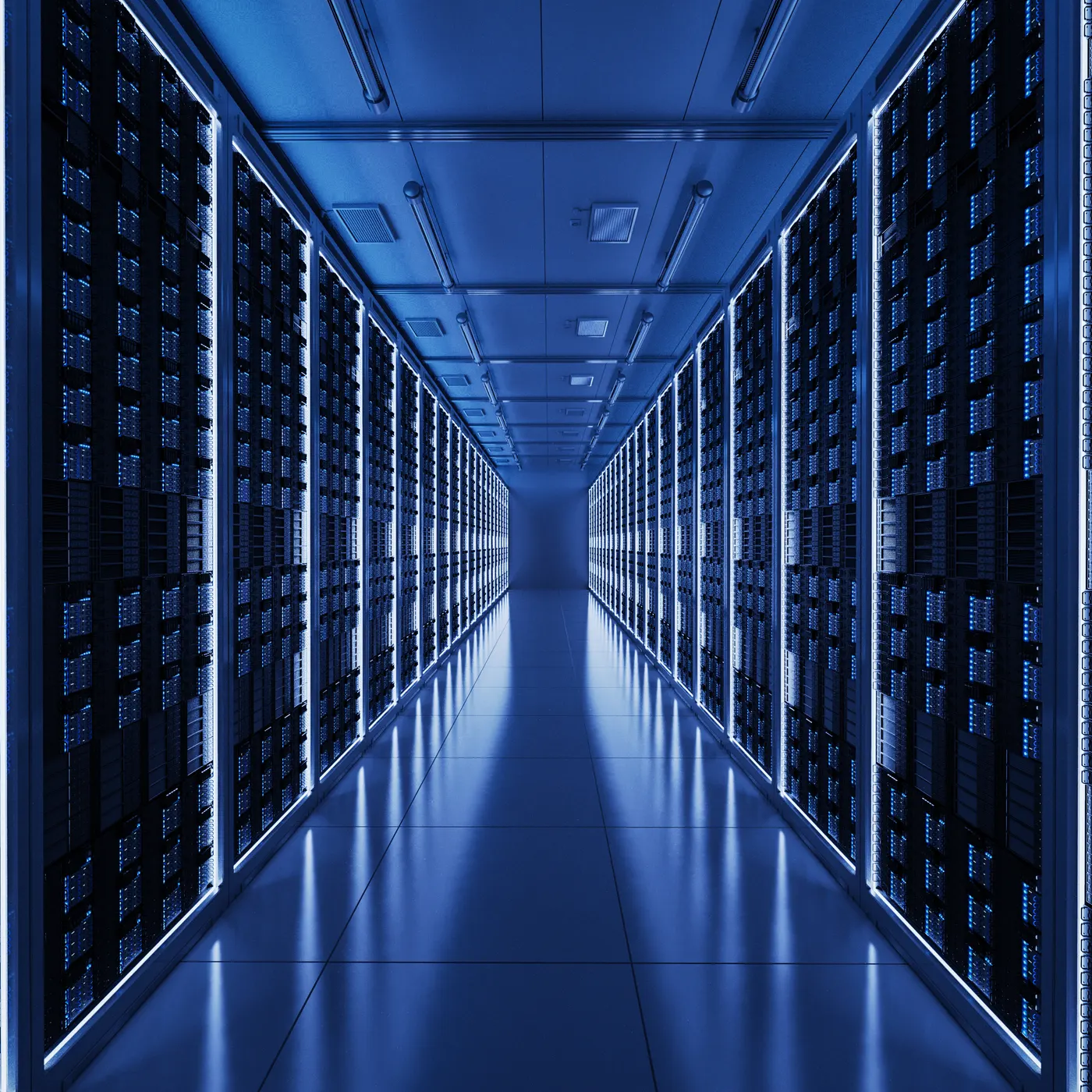 Data centre aisle lined with racked servers and structured cabling